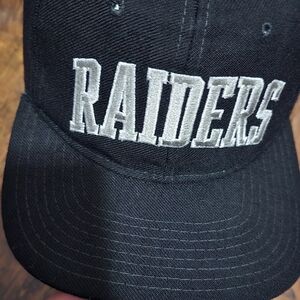 Vintage STARTER Black and Silver Raiders Hat rare Some Scratch Both Side Pannel